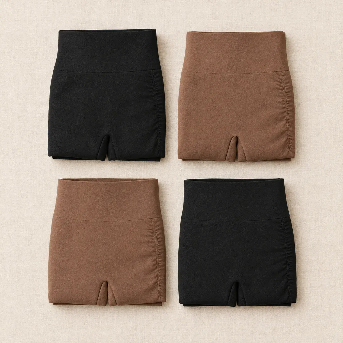 Four folded Lissely slip shorts, both colors